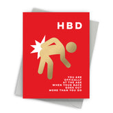 Red card with gold silhouette and white text on a white background