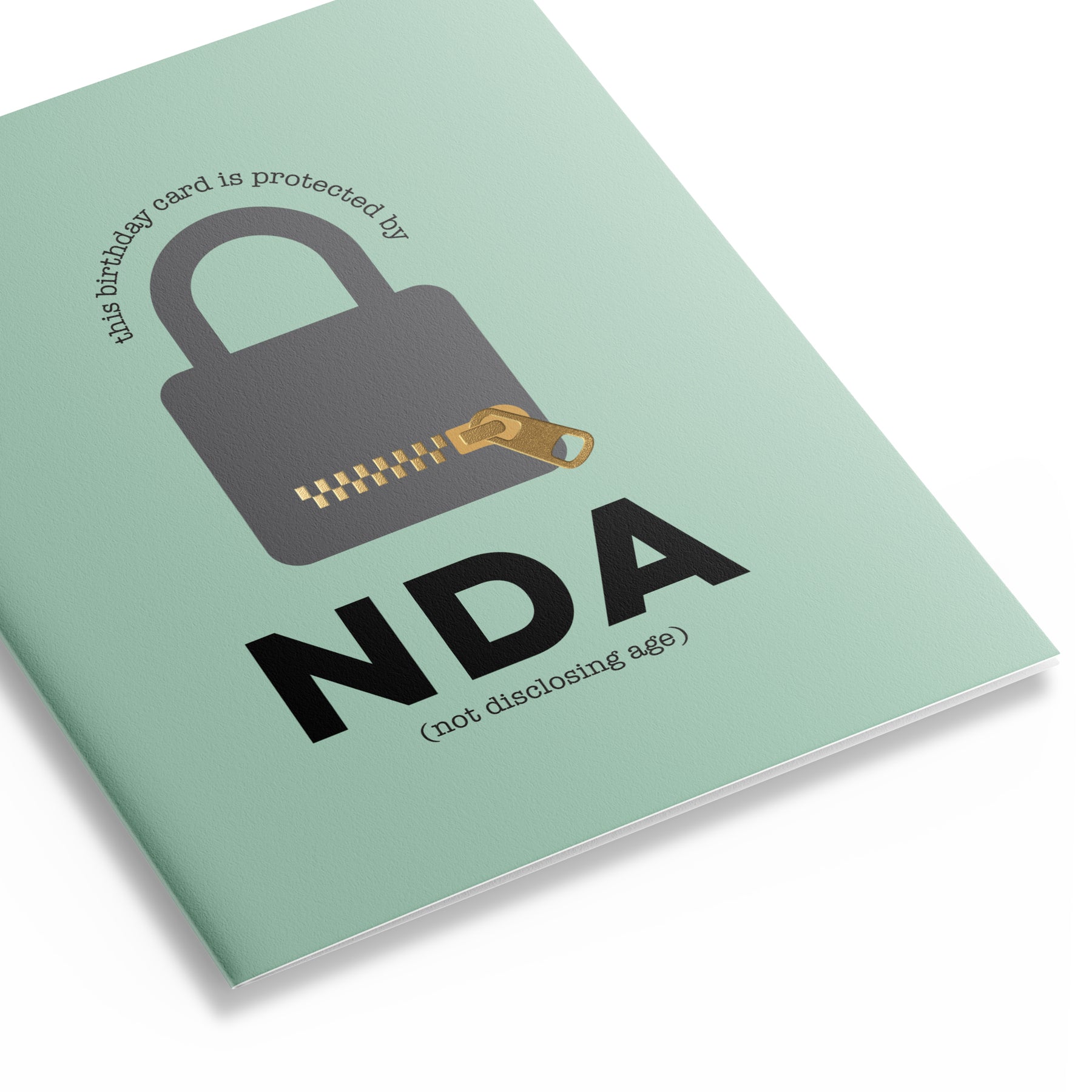 Three quarter perspective of green birthday card featuring a padlock with a message that reads "the birthday card is protected by NDA – not disclosing age"