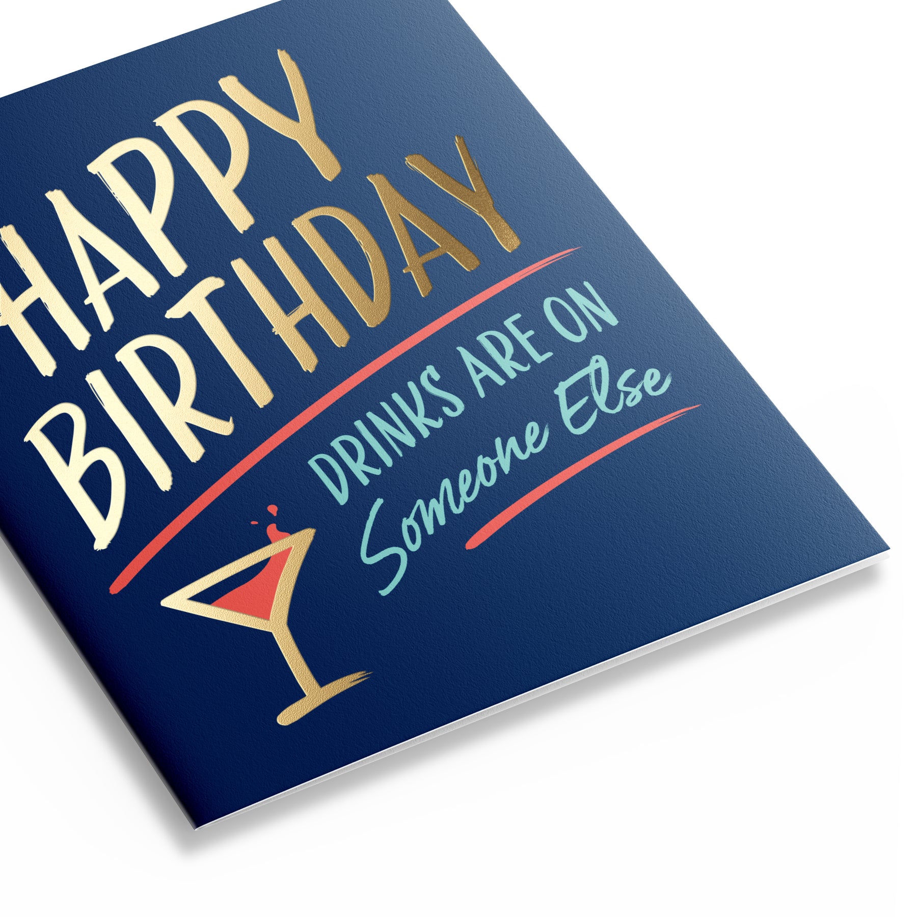 Three quarter view of birthday card with navy blue background that says "Happy Birthday – Drinks are on someone else". 