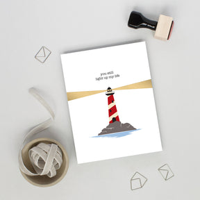 Card with a lighthouse illustration and text on a white background