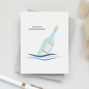 Greeting card with a bottle and message design on a white background