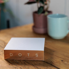 Rose Gold Gilded Notepads on wood surface 